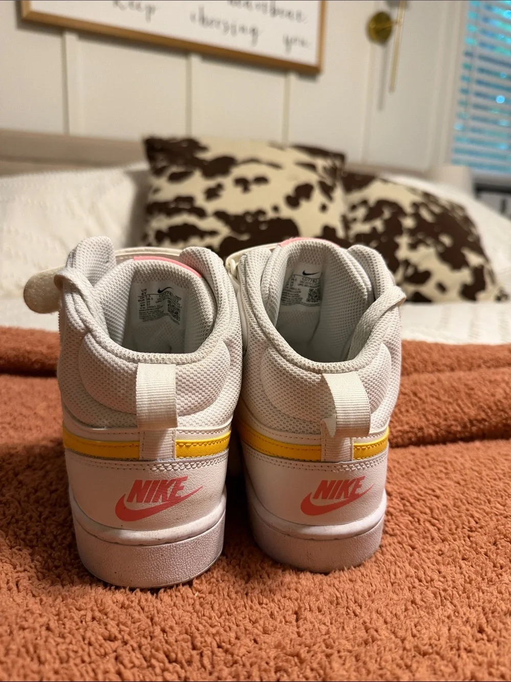 Nike White Mid-Top Sneakers with Yellow Swoosh